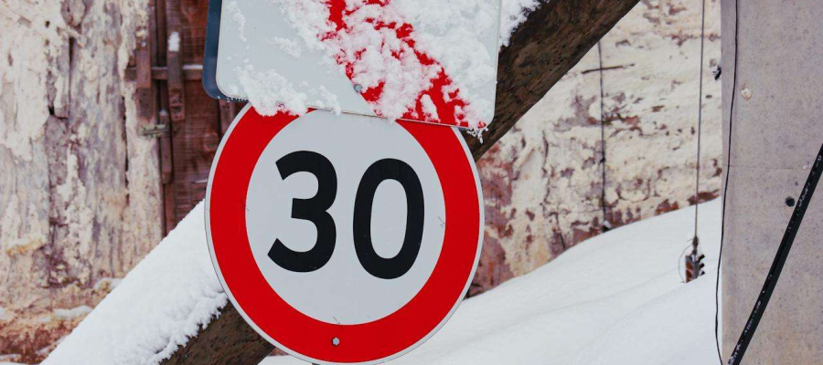 a snowy sign with the number 30 on