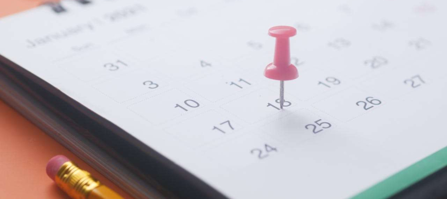 a calendar with a pin on a date