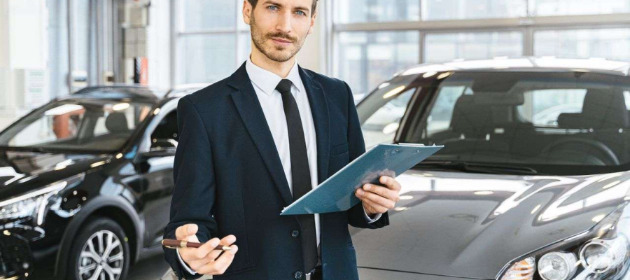 A person selling a car in a dealership