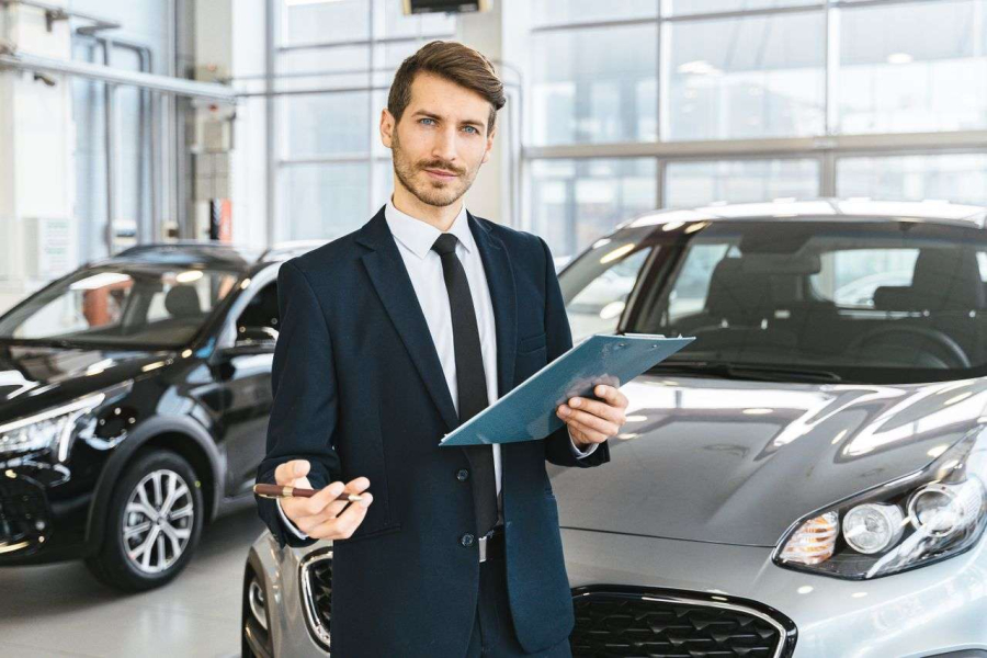 A person selling a car in a dealership