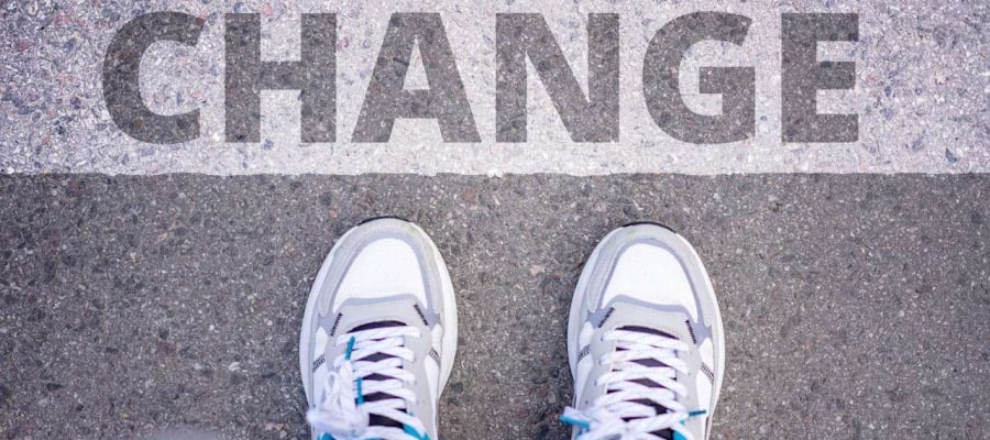 a man setting foot before a sign of change