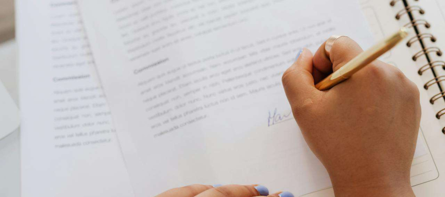 a person signing a contract