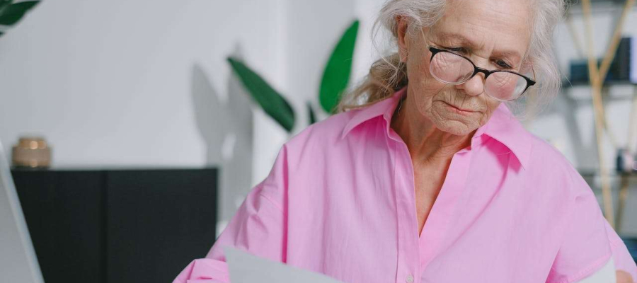 person sitting reading documents.