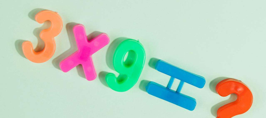 magnetic numbers showing a multiplication sum.