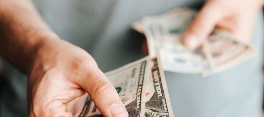 a man handing over some money