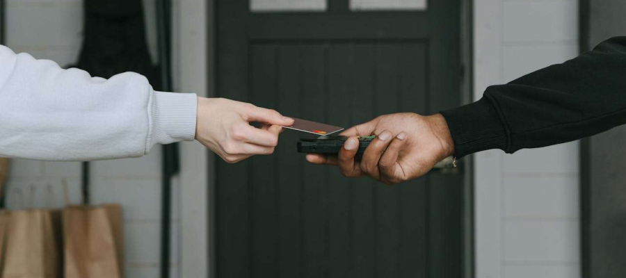 man paying via a card