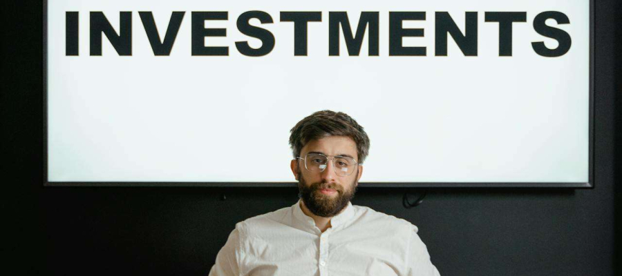 a man giving a presentation about investments