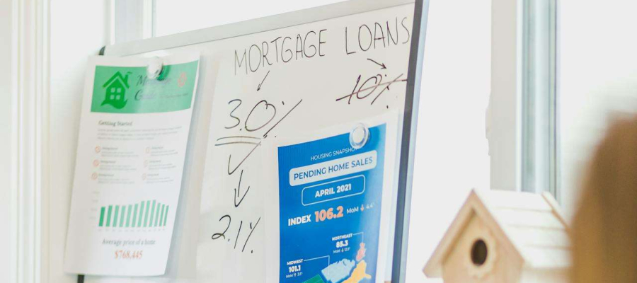 A whiteboard displaying percentages on mortgage loans