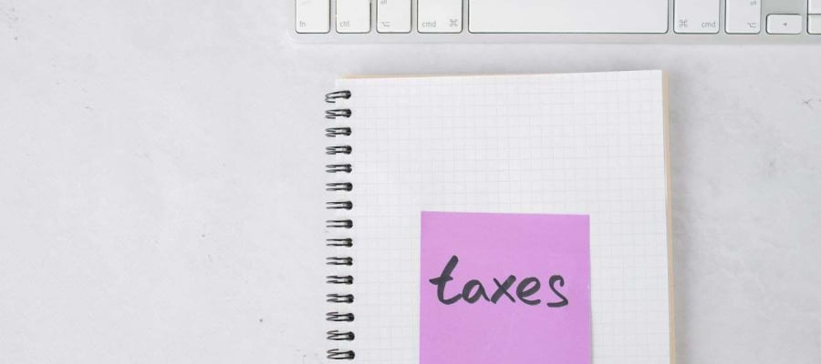 a notebook with the word taxes printed on it
