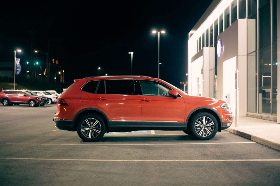 a car parked outside of a dealership