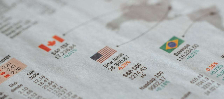 a newspaper showing the stock changes of international companies