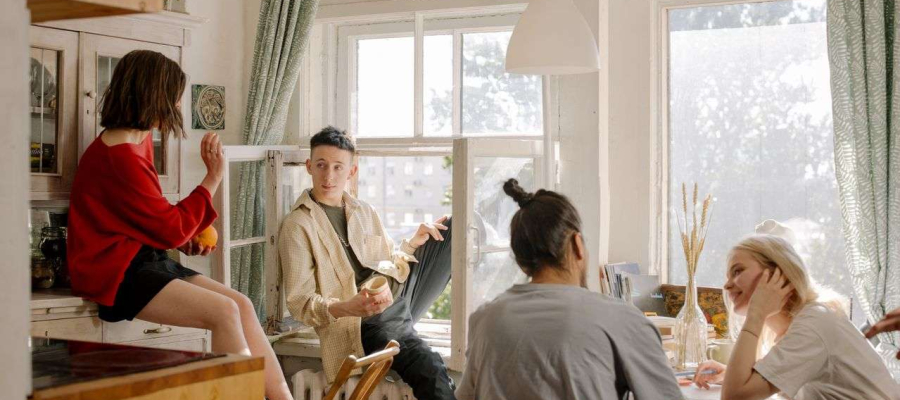 a group of students in a house relaxing