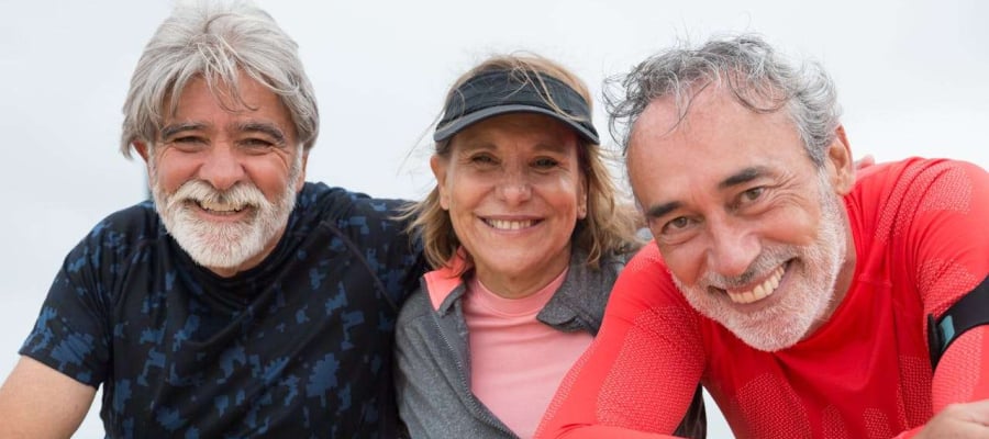 three retired people smiling