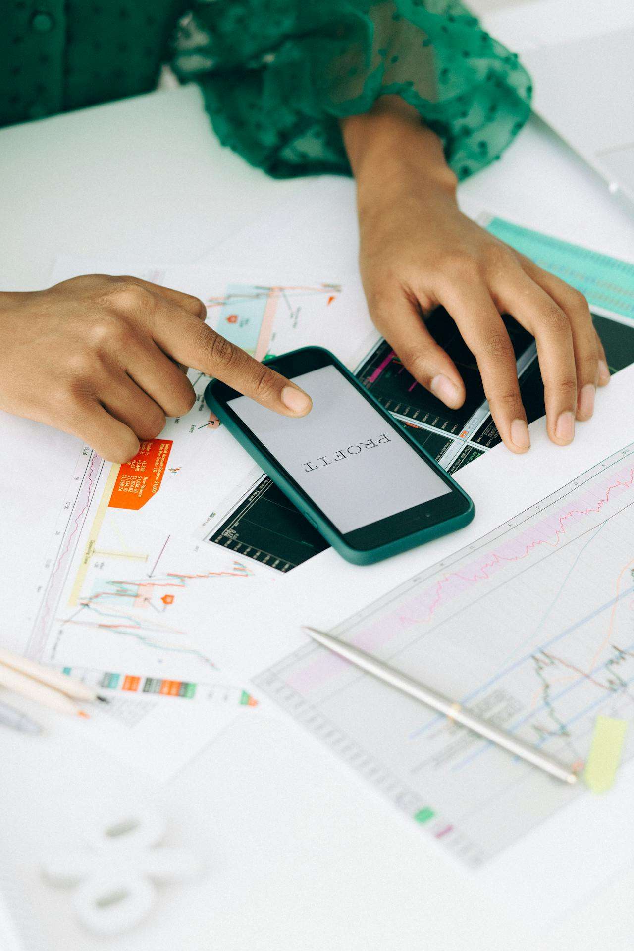person working out their profits based on calculations
