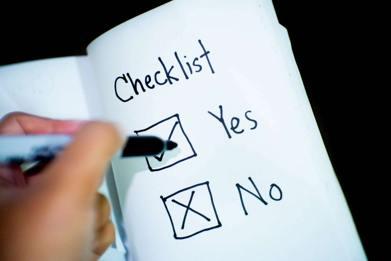 a notebook with a check list in it.