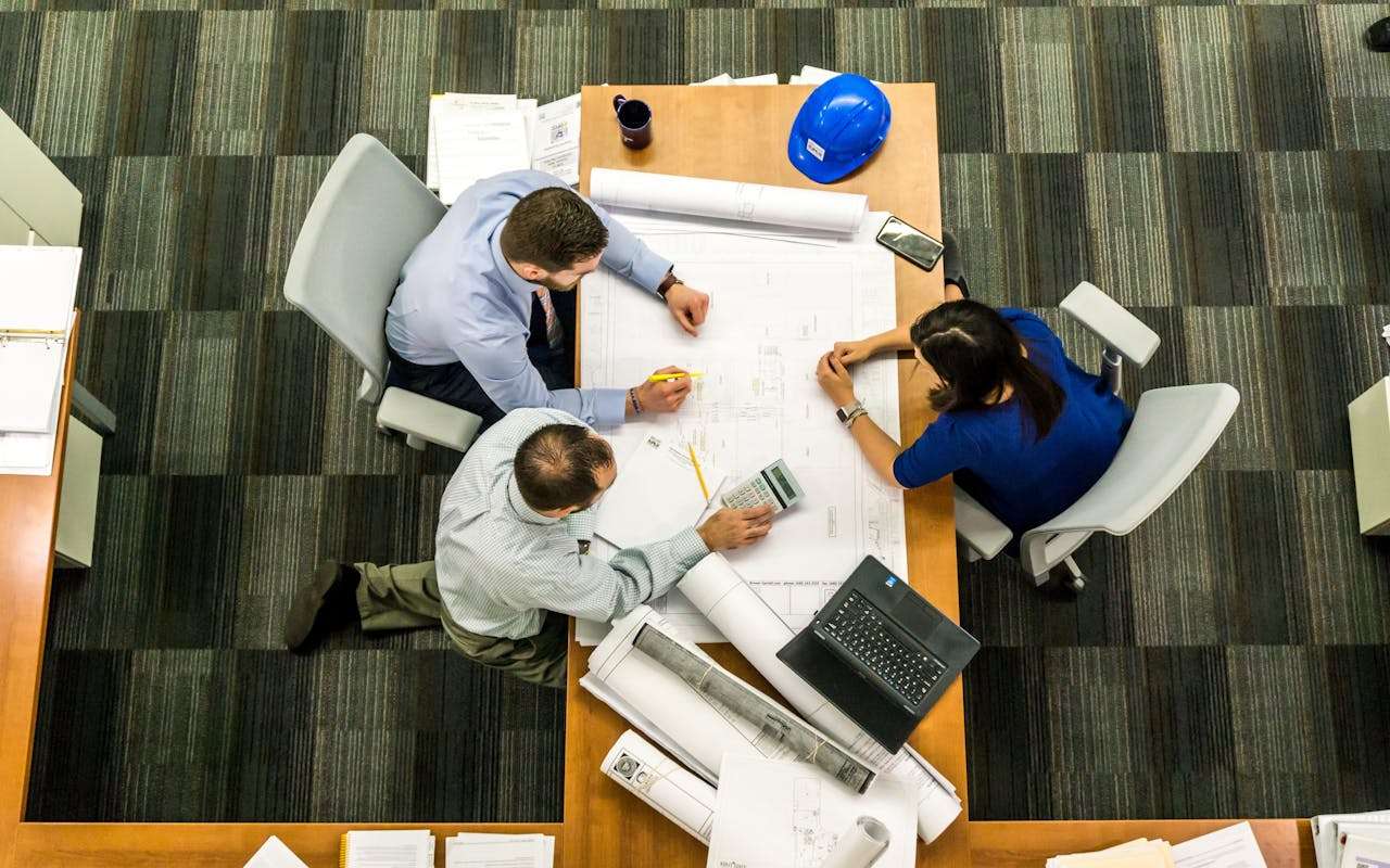 people having meeting around table
