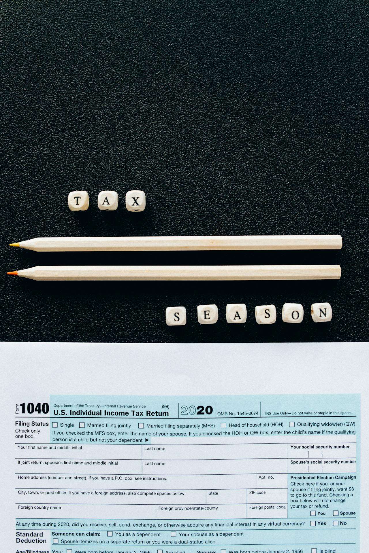 a tax bill with the text tax season above it along with pencils