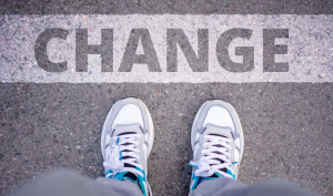 a man setting foot before a sign of change