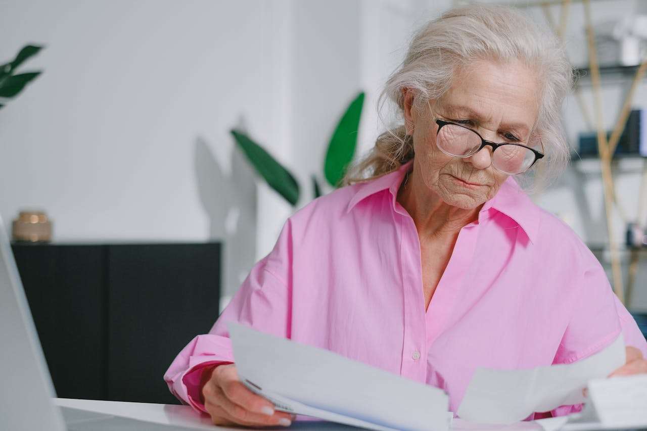 person sitting reading documents.