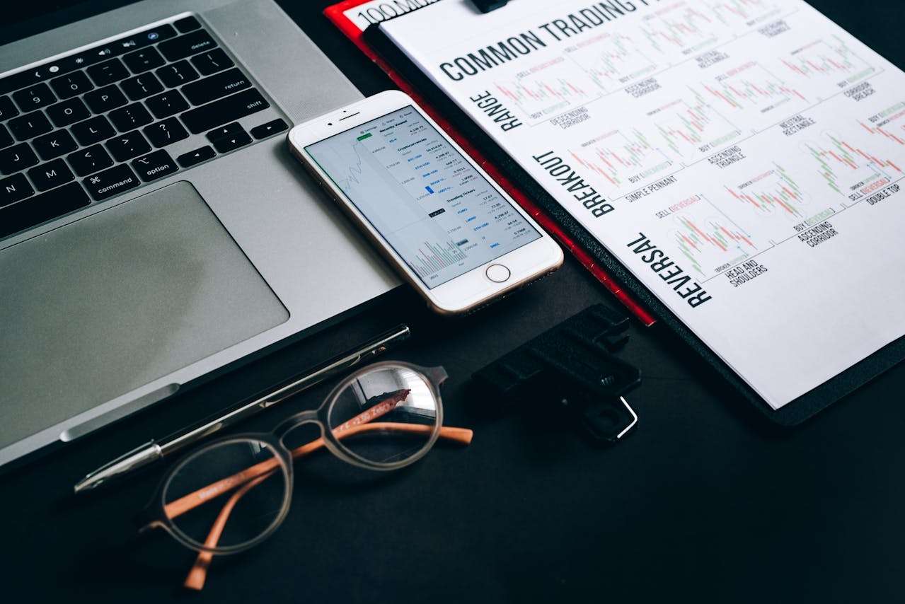 trading sheet phone laptop