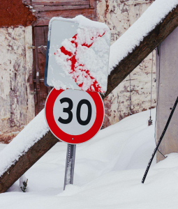 a snowy sign with the number 30 on