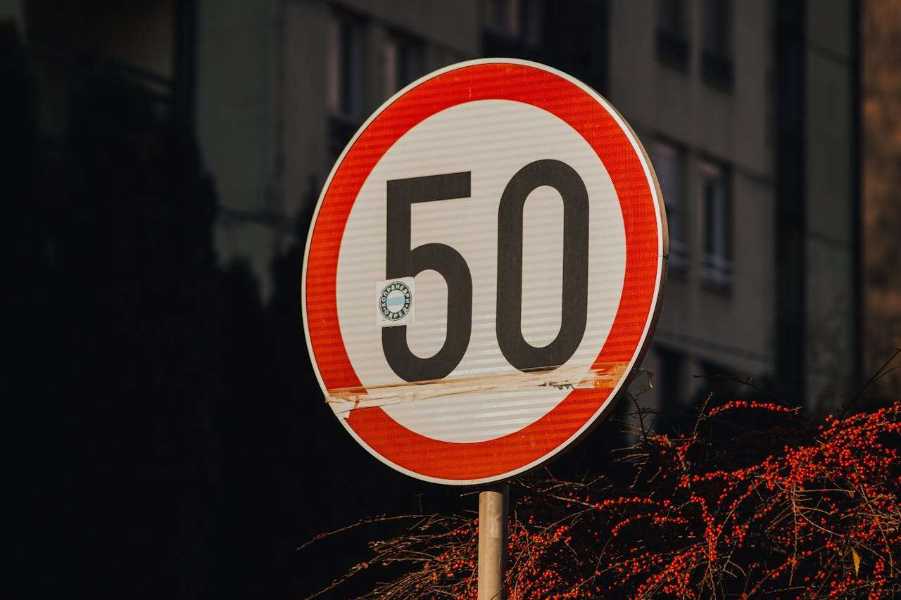 a road sign with 50 speed limit on it