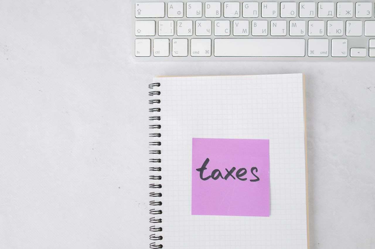 a notebook with the word taxes printed on it
